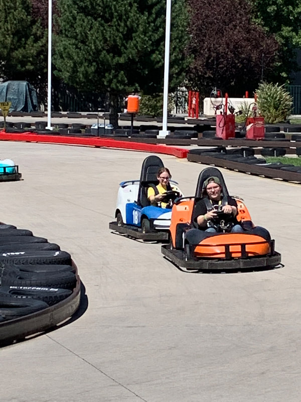 two people in go-carts
